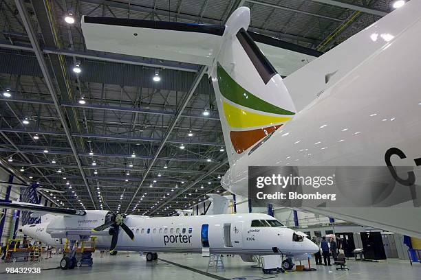 Bombardier Q400 NextGen turboprop airliner, built for Toronto's Porter Airlines, sits in the final stages of construction, in one of the hangars at...