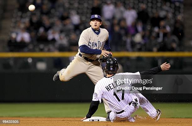 Second baseman David Eckstein of the San Diego Padres turns a double play on Todd Helton of the Colorado Rockies on a grounder by Troy Tulowitzki to...