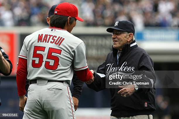 Yankee legend and Baseball Hall of Famer Yogi Berra greets Hideki Matsui of the Los Angeles Angels of Anaheim after he received his World Series ring...