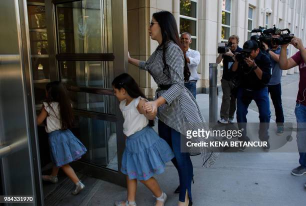 The wife of 'El Chapo', Emma Coronel Aispuro, arrives with her twin daughters at the US Federal Courthouse in Brooklyn before a hearing in the case...