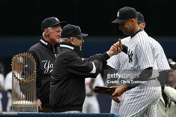 Yankee legend and Baseball Hall of Famer Yogi Berra presents Derek Jeter of the New York Yankees with his World Series ring for the 2009 season prior...