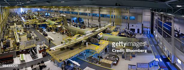This photo, which is made from 13 images stitched together in Photoshop, shows Bombardier Q400 NextGen turboprop airliners under construction, in one...