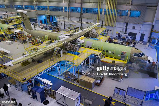 Bombardier Q400 NextGen turboprop airliners sit in various stages of contruction, in one of the hangars at the Bombardier Aerospace plant at...