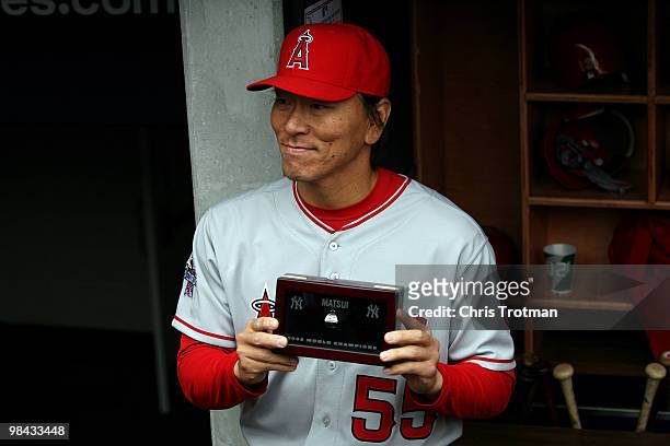 Hideki Matsui of the Los Angeles Angels of Anaheim poses after receiving his World Series ring for being a member of the 2010 New York Yankees...