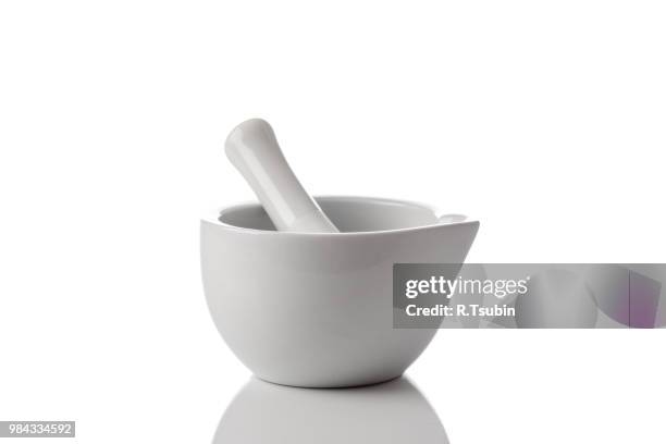 ceramic mortar and pestle on a white background - mortar and pestle stock pictures, royalty-free photos & images