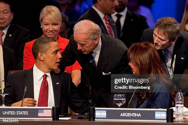 President Barack Obama speaks to U.S. Vice President Joseph Biden, center, and Cristina Fernandez de Kirchner, Argentina's president, right, during...