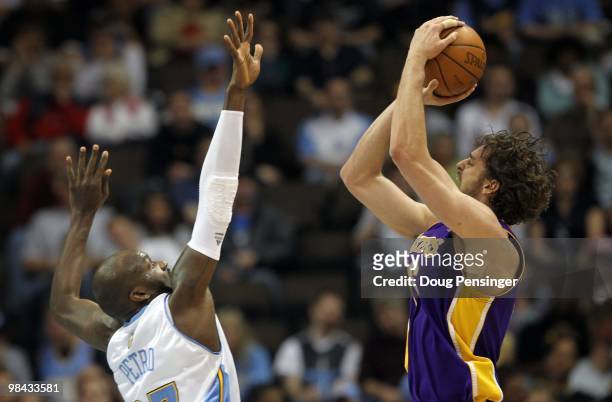 Pau Gasol of the Los Angeles Lakers takes a shot over Johan Petro of the Denver Nuggets during NBA action at the Pepsi Center on April 8, 2010 in...