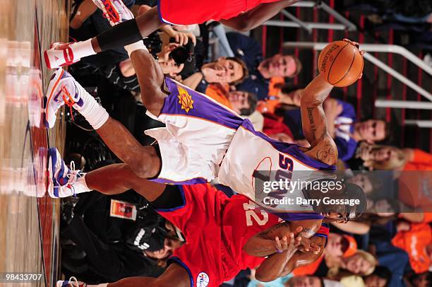 Amar'e Stoudemire of the Phoenix Suns drives the ball past Elton Brand of the Philadelphia 76ers during the game on February 24, 2010 at US Airways...