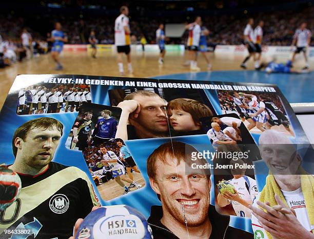 Fan magazine shows images of Oleg Velyky during a charity match for benefit of Oleg Velyky's family at the Color Line Arena on April 13, 2010 in...