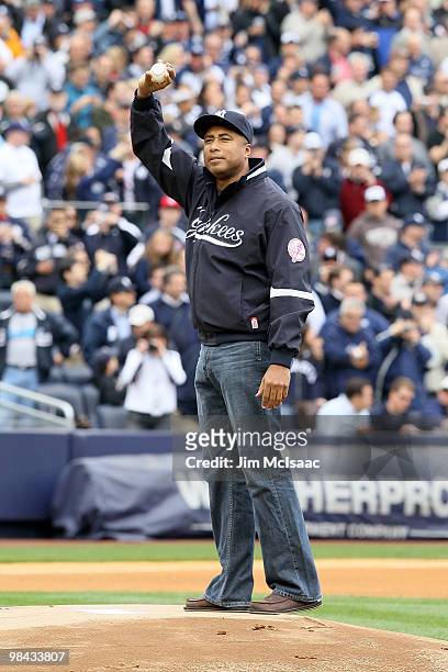 Bernie Williams, former player for the New York Yankees, acknowledges the fans as he gets set to throw out the ceremonial first pitch against the Los...