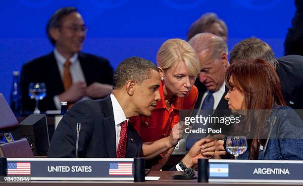 President Barack Obama speaks with Argentina's President Cristina Fernandez de Kirchner during the opening plenary of the Nuclear Security Summit at...