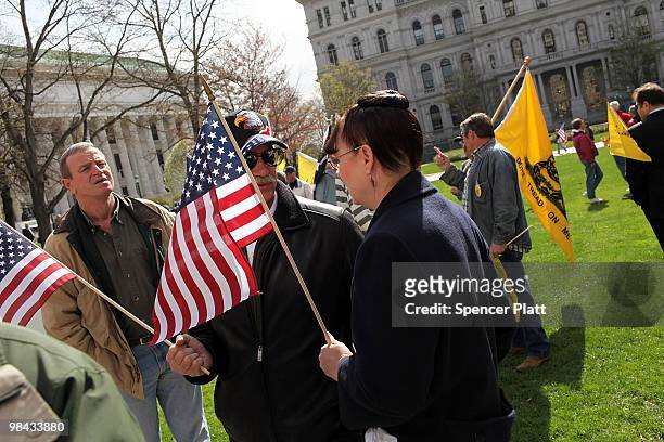 People attend a Tea Party Express rally on April 13, 2010 in Albany, New York. The Tea Party Express will head to Boston on Wednesday where the...