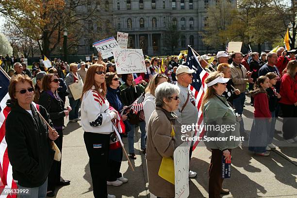 People attend a Tea Party Express rally on April 13, 2010 in Albany, New York. The Tea Party Express will head to Boston on Wednesday where the...