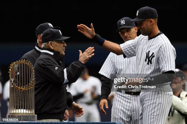 Yankee legend and Baseball Hall of Famer Yogi Berra presents Derek Jeter of the New York Yankees with his World Series ring for the 2009 season prior...