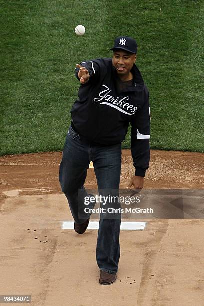 Bernie Williams, former player for the New York Yankees throws out the ceremonial first pitch against the Los Angeles Angels of Anaheim during the...