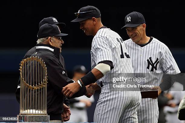 Yankee legend and Baseball Hall of Famer Yogi Berra presents Alex Rodriguez of the New York Yankees with his World Series ring for the 2009 season as...