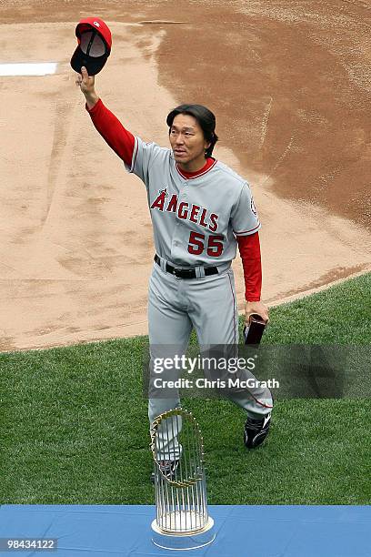 Hideki Matsui of the Los Angeles Angels of Anaheim acknowledges the fans after he received his World Series ring for being a member of the 2009 New...