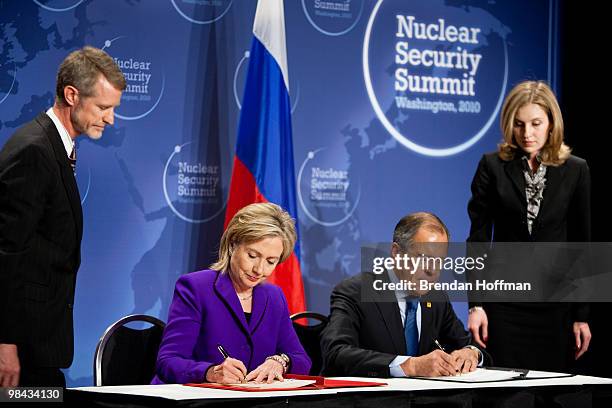 Secretary of State Hillary Clinton and Russian Foreign Minister Sergey Lavrov sign a plutonium disposition protocol at the Nuclear Security Summit on...