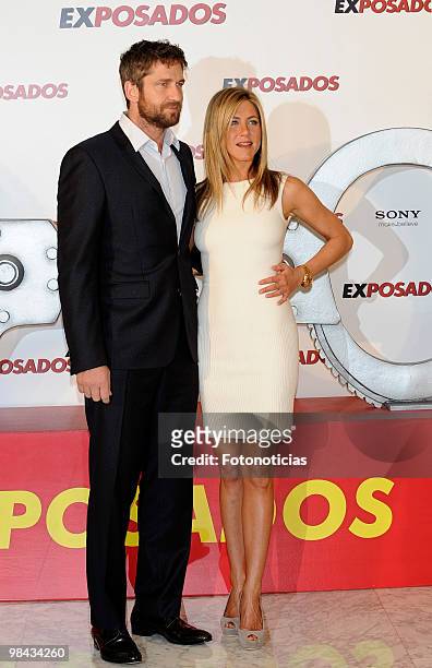 Actress Jennifer Aniston and actor Gerard Butler attend 'Exposados' photocall, at the Villamagna Hotel on March 30, 2010 in Madrid, Spain.