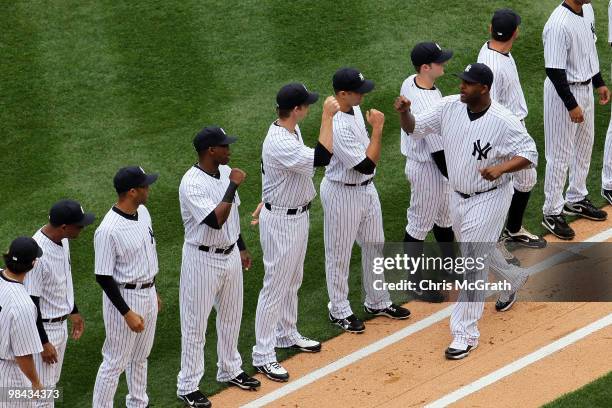 Sabathia of the New York Yankees greets his team during player introduction before playing against the Los Angeles Angels of Anaheim during the...