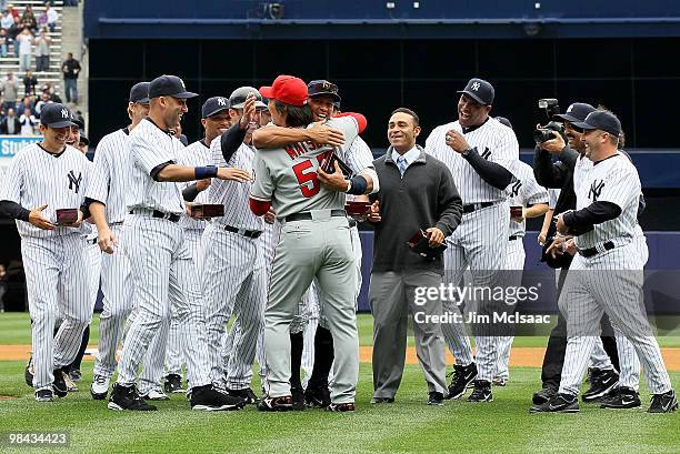 Hideki Matsui of the Los Angeles Angels of Anaheim is greeted by former teammates including Derek Jeter and Alex Rodriguez of the New York Yankees...