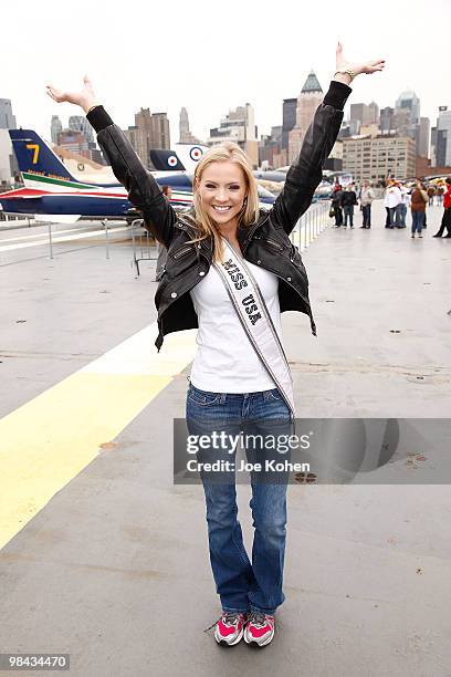 Miss USA Kristen Dalton packs goody bags for overseas troops at the Intrepid Sea-Air-Space Museum on April 13, 2010 in New York City.