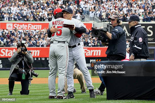 Manager Joe Girardi of the New York Yankees greets Hideki Matsui of the Los Angeles Angels of Anaheim after Matsui received his 2009 World Series...