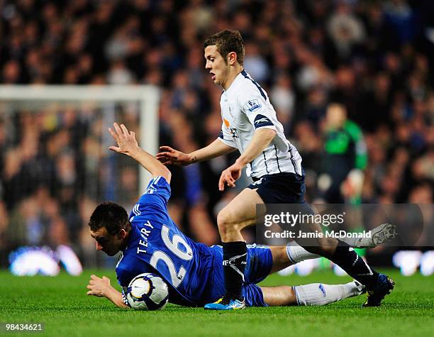 Jack Wilshere of Bolton Wanderers challenges John Terry of Chelsea during the Barclays Premier League match between Chelsea and Bolton Wanderers at...