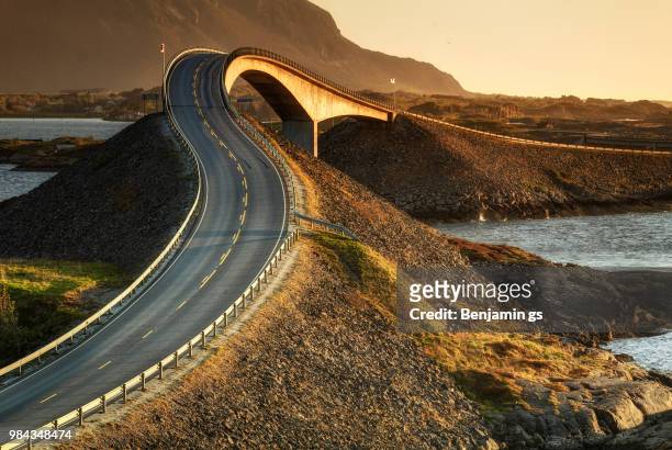 a road over water in norway. - norway road stock pictures, royalty-free photos & images