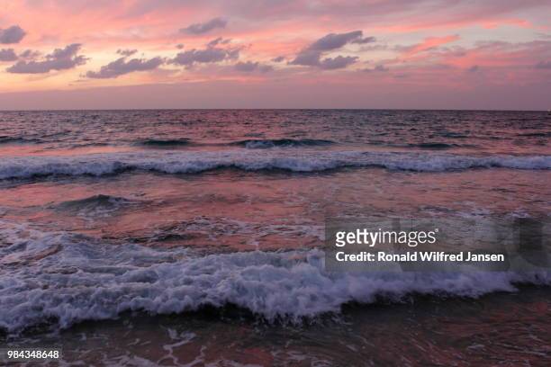 the mediterranean in the light of the setting sun, netanya, israel - netanya stock pictures, royalty-free photos & images