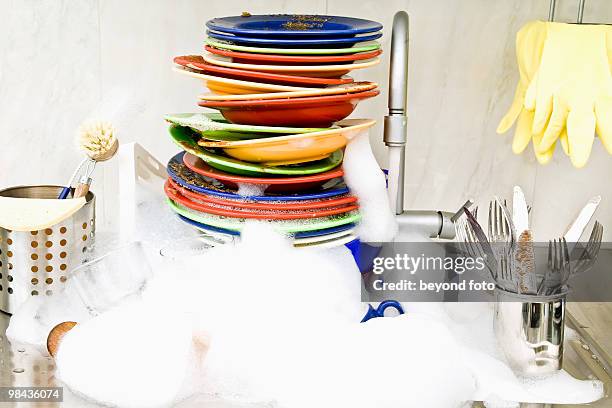 washing-up in kitchen sink - washing up stock pictures, royalty-free photos & images