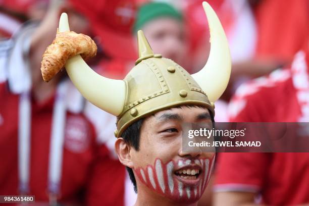 Denmark fan wears a viking helmet before the Russia 2018 World Cup Group C football match between Denmark and France at the Luzhniki Stadium in...