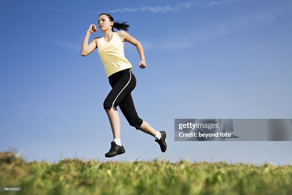 Young woman jogging in park