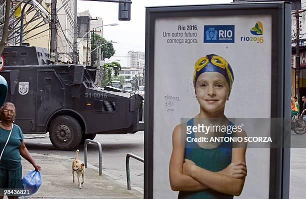 Police in an armoured assault vehicle patrol the streets near Morro dos Macacos shantytown , on October 20, 2009. More than 1,700 officers were...