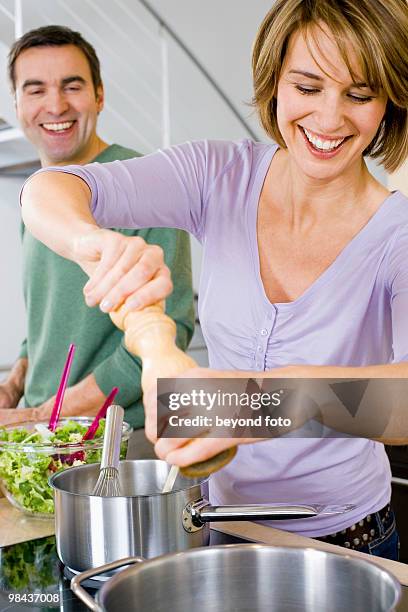 couple cooking together - pepper mill bildbanksfoton och bilder