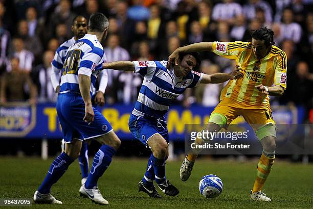 Newcastle United player Jonas Guitierrez takes on the Reading defence during the Coca-Cola Championship game between Reading and Newcastle United at...