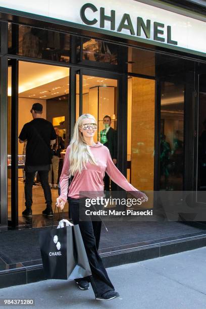 Paris Hilton is seen leaving the CHANEL store on Avenue Montaigne on June 26, 2018 in Paris, France.