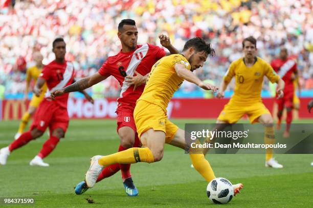 Mathew Leckie of Australia is challenged by Miguel Trauco of Peru during the 2018 FIFA World Cup Russia group C match between Australia and Peru at...