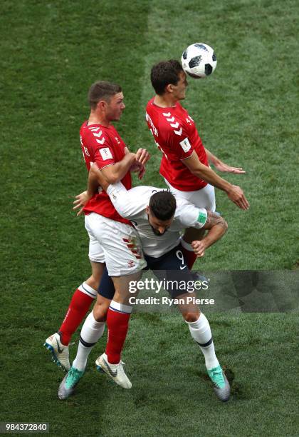 Andreas Christensen of Denmark wins a header over Olivier Giroud of France during the 2018 FIFA World Cup Russia group C match between Denmark and...