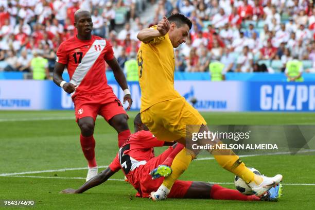 Australia's forward Tomi Juric vies for the ball with Peru's defender Christian Ramos and Peru's defender Luis Advincula during the Russia 2018 World...