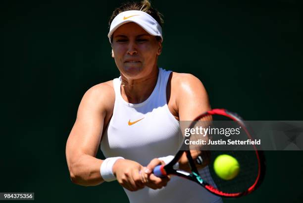 Eugenie Bouchard of Canada plays a backhand against Lin Zhu of China during Wimbledon Championships Qualifying - Day 2 at The Bank of England Sports...