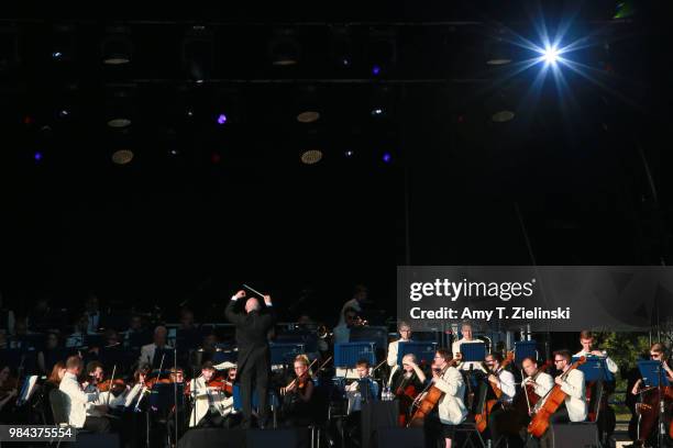 Conductor Paul Bateman leads the Royal Philharmonic Concert Orchestra during The Heritage Live Concert Series on stage at Kenwood House on June 24,...
