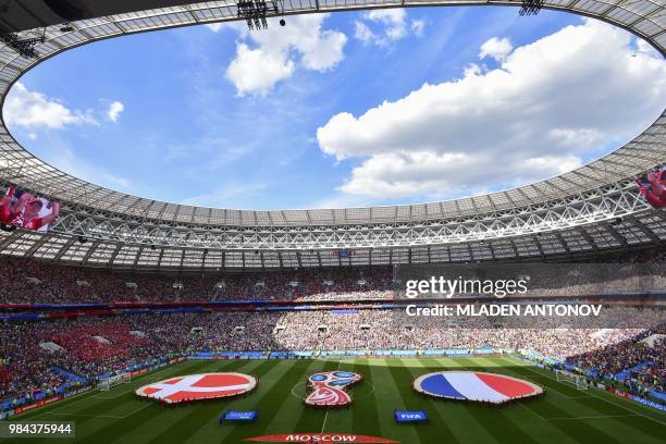 Supporters prepare for the start of the Russia 2018 World Cup Group C football match between Denmark and France at the Luzhniki Stadium in Moscow on...