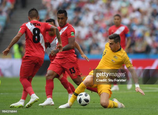 Tomi Juric of Australia under pressure from Christian Cueva, Yoshimar Yotun and Renato Tapia of Peru during the 2018 FIFA World Cup Russia group C...