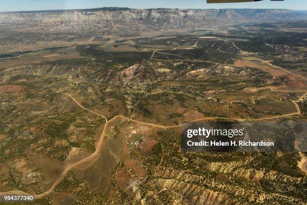 Existing gas and oil development near the western slope town of De Beque can be seen from an EcoFlight plane on June 25, 2018 in De Beque, Colorado....