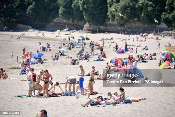 People on the beach at Barry Island, Vale of Glamorgan, Wales, as temperatures are predicted to increase this week.