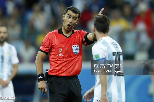 Referee Ravshan Irmatov, Lionel Messi of Argentina during the 2018 FIFA World Cup Russia group D match between Argentina and Croatia at the Novgorod...