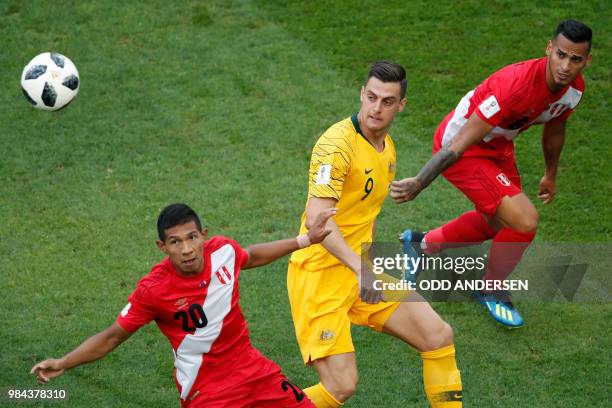 Peru's midfielder Edison Flores vies for the ball with Australia's forward Tomi Juric during the Russia 2018 World Cup Group C football match between...