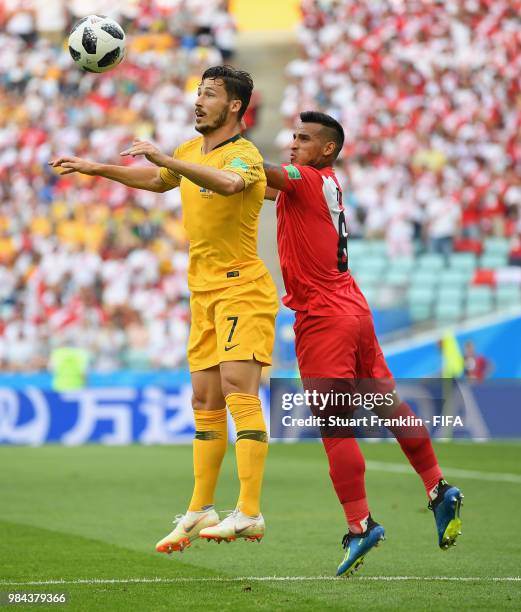 Mathew Leckie of Australia and Miguel Trauco of Peru compete for a header during the 2018 FIFA World Cup Russia group C match between Australia and...