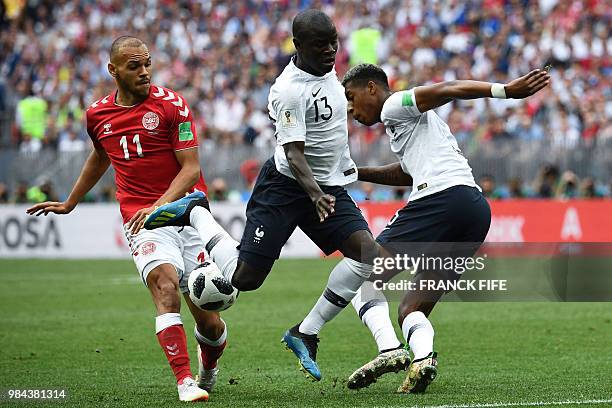 France's defender Presnel Kimpembe and France's midfielder N'Golo Kante vie with Denmark's forward Martin Braithwaite during the Russia 2018 World...